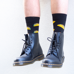 man wearing dr martens 1460 smooth black boots and lafitte taco print socks
